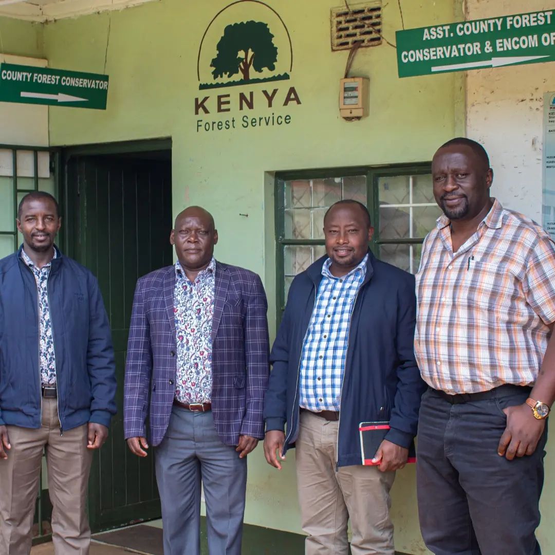 Team visiting with the Kenya Forest Service. Reforestation partners work closely with local officials to ensure the right regions are being developed, and the local society is being impacted positively.