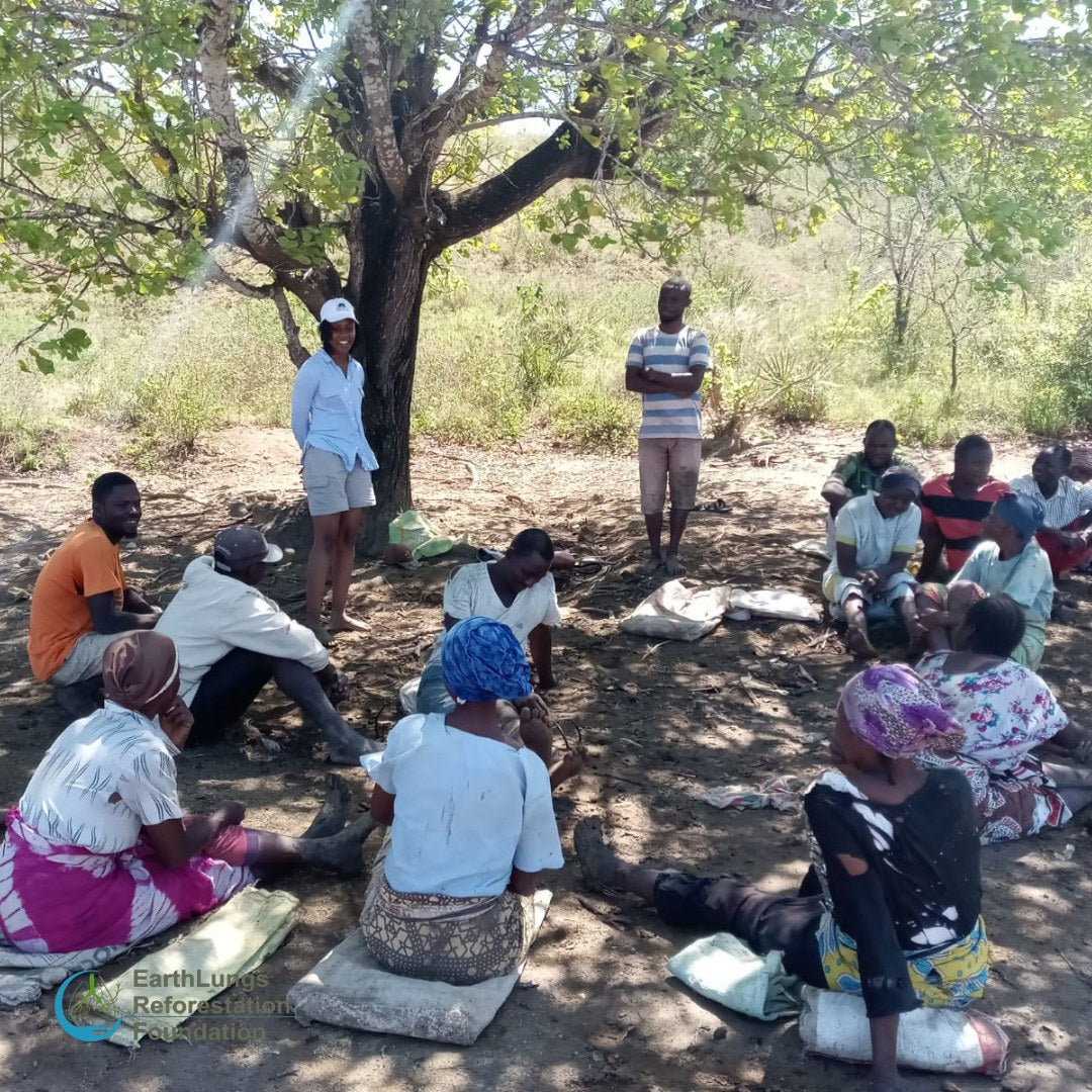 An Earthlungs reforestation team meeting on site
