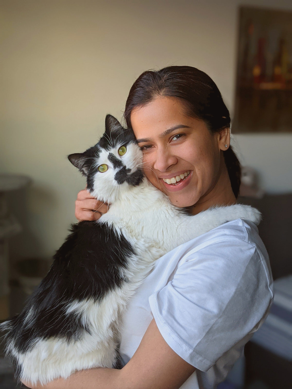 Co-founder hugging her cat